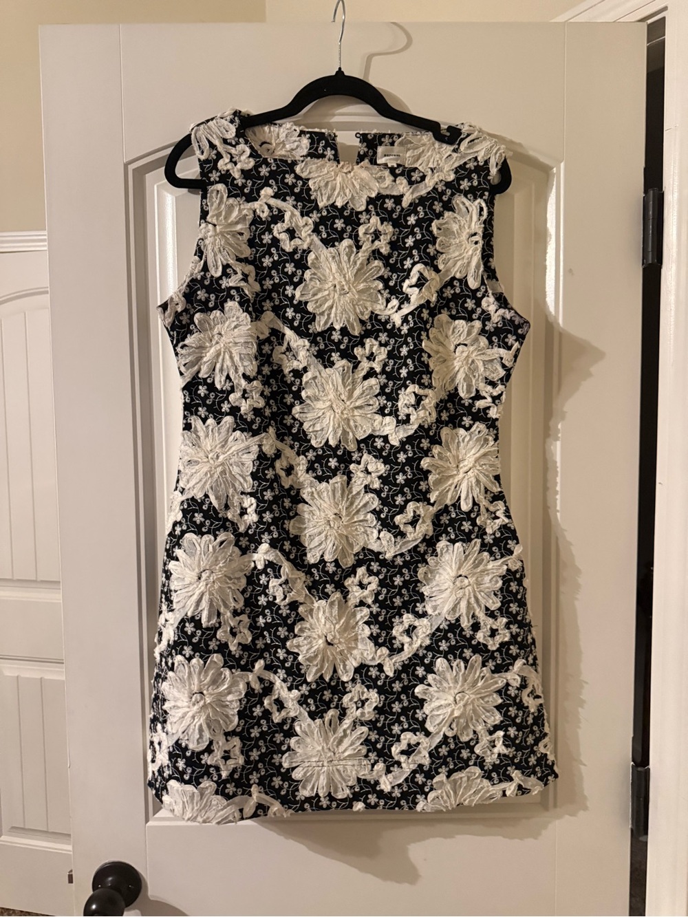 AUREUM Black Mini Dress with White Floral Appliqué